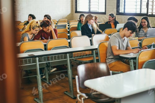 Preview: Young Multiethnic Students Working Together Inside Classroom At School University - Focus On Blond