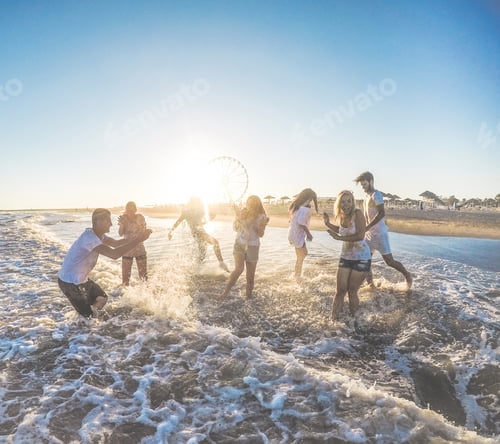 Preview: Happy Friends Having Fun On The Beach At Sunset - Young People Playing Inside Sea Water Outdoor In