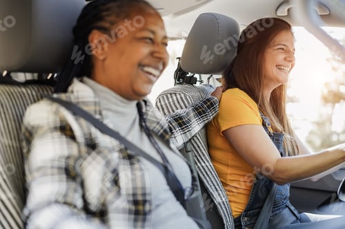 Preview: Multiracial Senior Friends Having Fun On The Road With Mini Van Camper - Focus On Right Woman Face