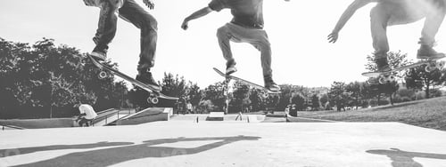 Preview: Skaters Jumping With Skateboard In City Park - Young Skate Guys Performing Tricks And Skills