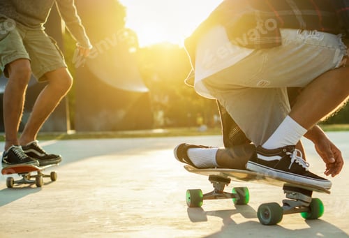Preview: Two Young Skaters Performing With Skateboard At Sunset In Urban City Park - Young People Having Fun