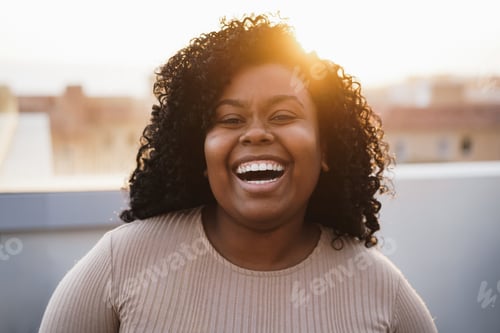 Preview: Happy Young African Girl Looking At Camera Outdoors At Summer Sunset - Focus On Face