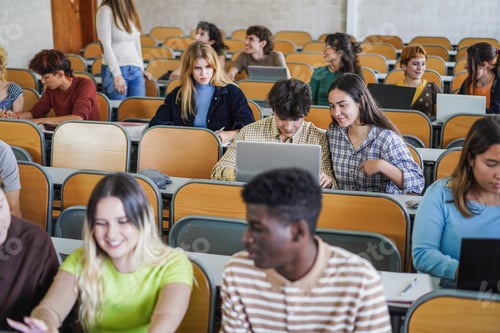 Preview: Young Multiethnic Students Working With Tablets Inside Classroom At School University - Focus On