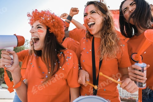 Preview: Orange Sport Fans Screaming While Supporting Their Team Out Of The Stadium - Focus On Left Girl Face