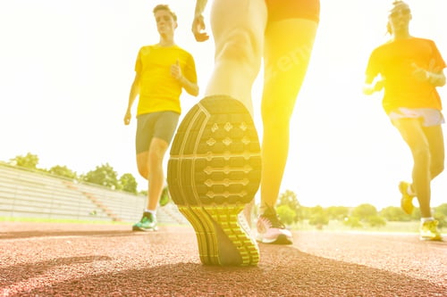 Preview: Runners Training Before Sport Competition In A Athletic Running Track - Young Young Multi Race