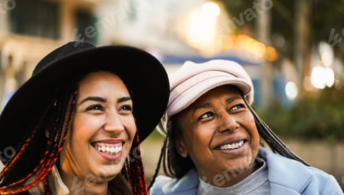 Preview: African Mother And Daughter Having Fun Together During Winter Time Outdoor - Main Focus On Senior