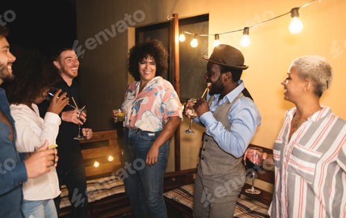 Preview: Happy Friends Cheering And Drinking Cocktails At Home Terrace Party Outdoor - Nightlife Concept