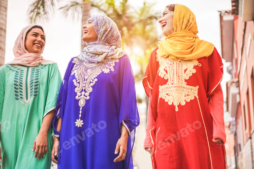 Preview: Happy Arabic Friends Walking In City Center - Young Arabian Women Having Fun Together On Sunny Day