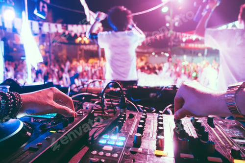 Preview: Dj Mixing Outdoor At Beach Party Festival Outdoor With Crowd Of People In Background - Soft Focus
