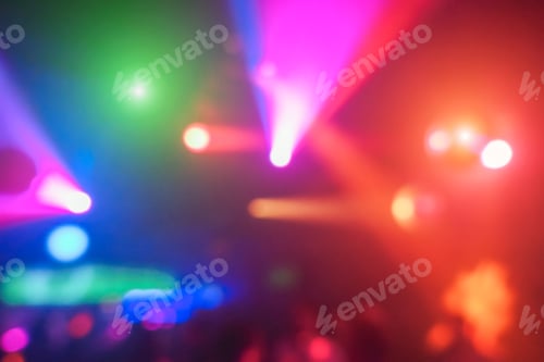 Preview: Blurred People Dancing In Night Disco Club With Color Laser Lights In Background - Concept Of