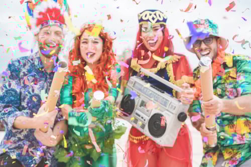 Preview: Blurred Dressed People Celebrating At Carnival Party Throwing Confetti - Young Friends Having Fun