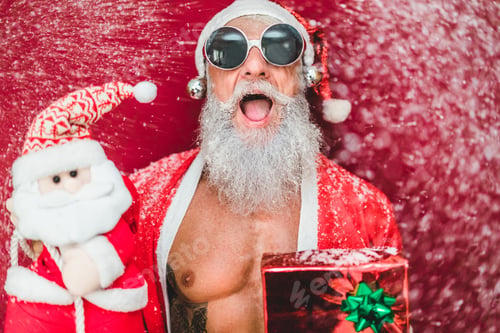 Preview: Tattoo Happy Santa Clause With Gift Box And Christmas Man Puppet With Snow Falling Down On Him