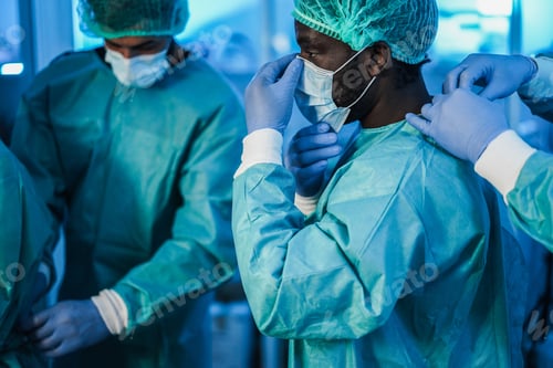 Preview: Doctors Preparing To Work In Hospital During Coronavirus Pandemic Outbreak - Focus On African Man