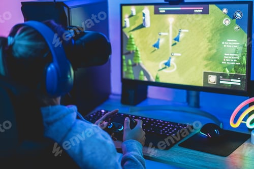Preview: Girl Gamer Playing Strategy Game Online Using Virtual Reality Headset - Soft Focus On Right Hand