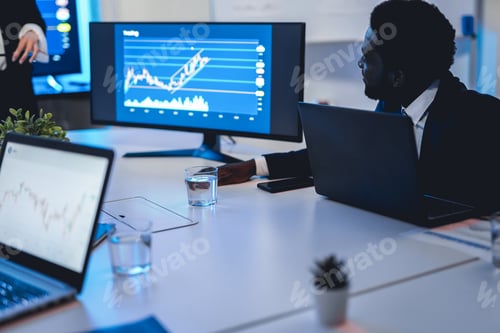 Preview: Business Trader Team Doing Blockchain Analysis Inside Hedge Fund Office - Focus On African Man Face