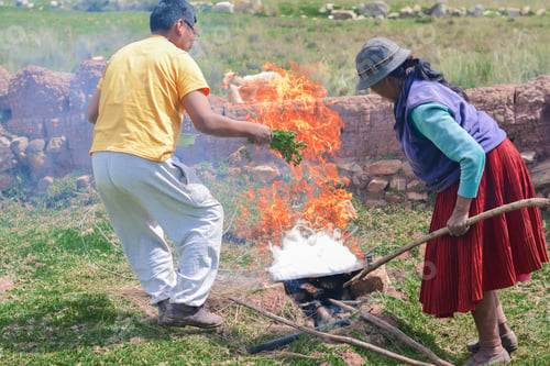 Preview: Native American Man And Woman Cooking In The Countryside With Very Dangerous Flames.
