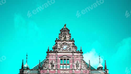 Preview: A Low Angle Wide Shot Of A High Clocktower On A Beautiful Sky Blue Background