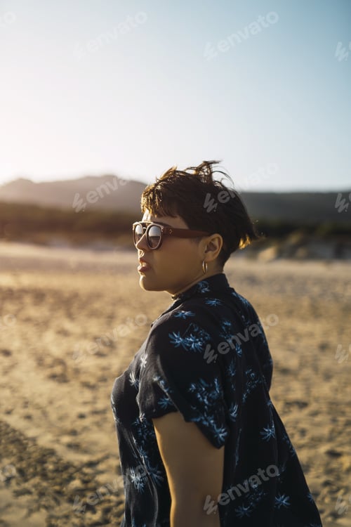 Preview: A Vertical Shot Of A Young Beautiful Woman Wearing Sunglasses