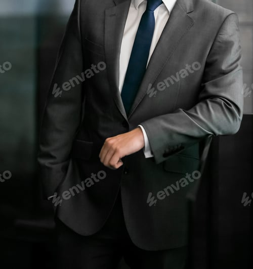 Preview: A Selective Focus Shot Of A Male In A Suit With Tie