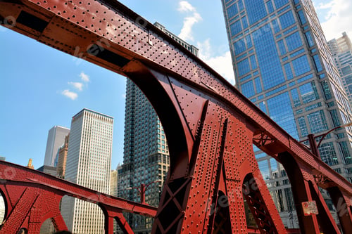 Preview: A Low Angle Shot Of A Red Iron Bridge And High-Rise Buildings Chicago