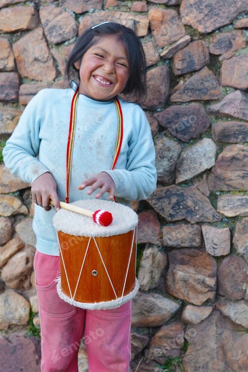 Preview: Little Native American Girl Playing Traditional Sikuri Drum.