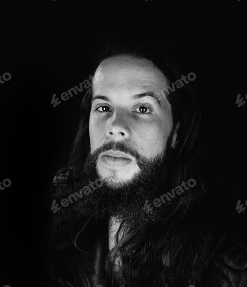 Preview: Studio Photography With Black Background Of A Hipster Style Man Wearing Leather Jacket.