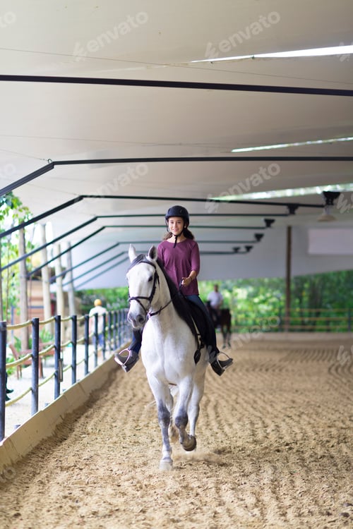 Preview: Beautiful Teenager Riding A Horse In A Ranch