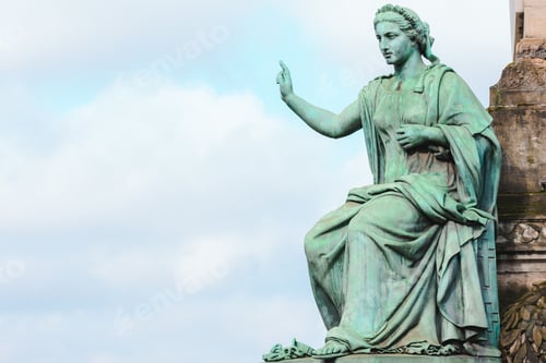 Preview: A Closeup Of The Statue Of The Congress Column Under The Sunlight And A Cloudy Sky In Brussels