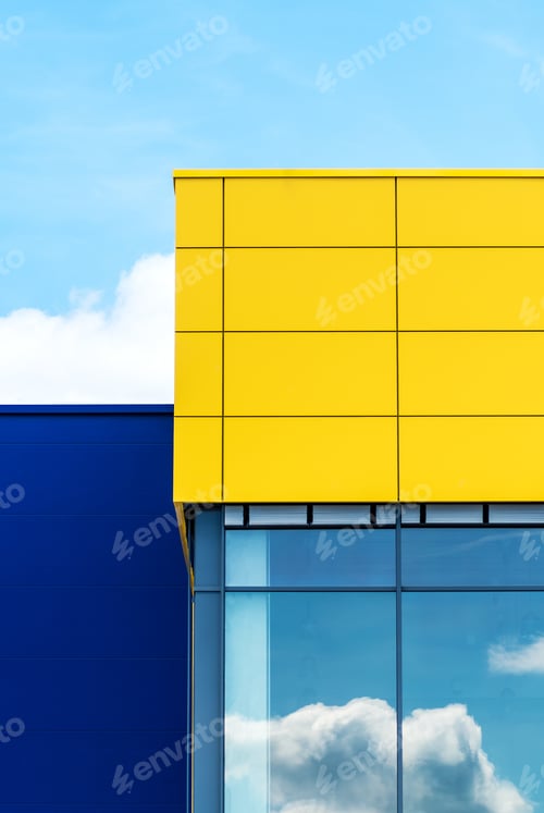 Preview: A Vertical Shot Of A Colorful Modern Building With Glass Windows