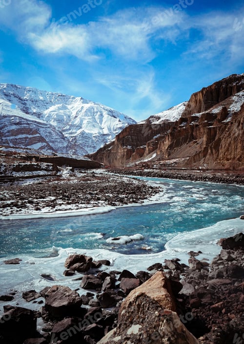 Preview: A Vertical Shot Of Spiti Valley In Winter With Frozen River And Snow Peak Mountains