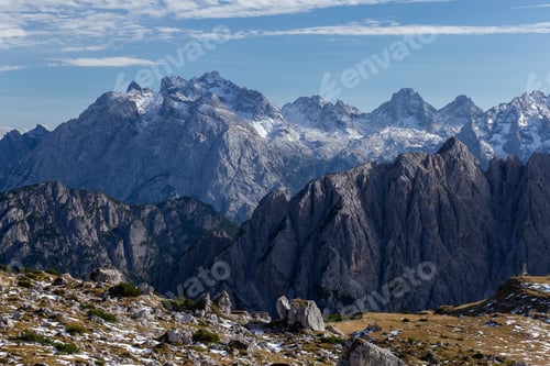 Preview: A Breathtaking Shot Of Snowy Rocks In The Italian Alps Under The Bright Sky
