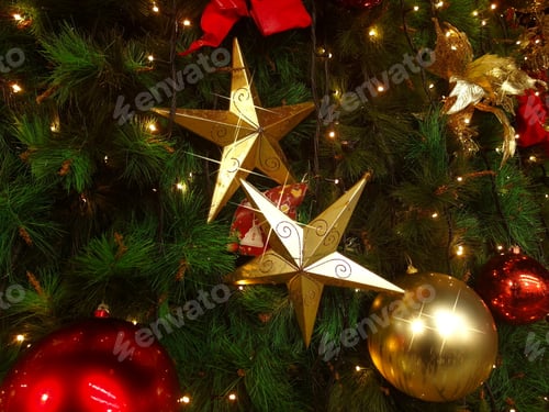 Preview: A Closeup Shot Of A Decorated Christmas Tree With Balls,Stars, Ribbons And Led Lights