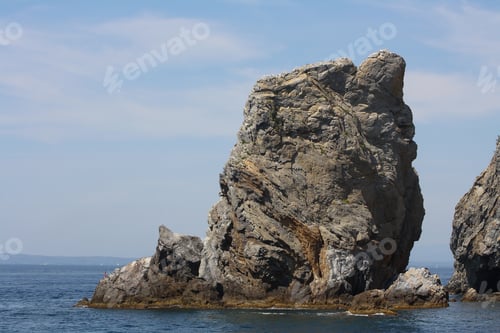 Preview: A Beautiful Shot Of Large Stone Formations In The Water Near Cadaques, Spain