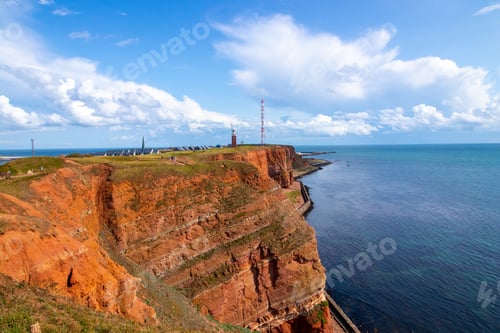 Preview: A Breathtaking Scenery Of Industrial Buildings On The Edge Of The Rocky Seashore