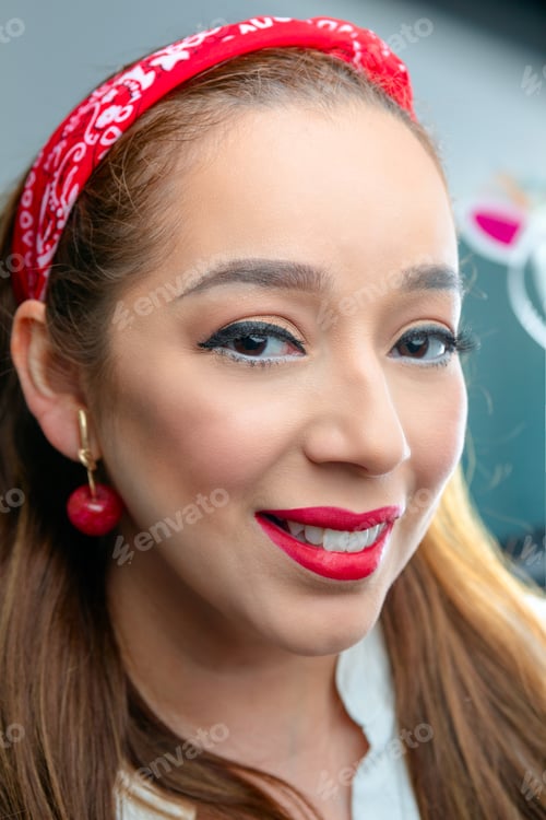 Preview: A Portrait Of A Young Woman Smiling To The Camera With A Red Lipstick And Casual Makeup On.