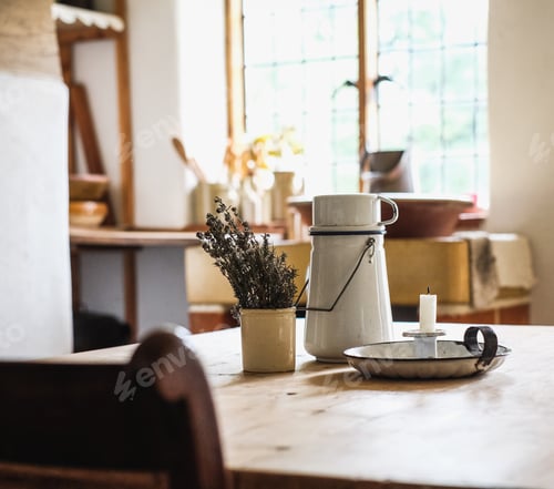 Preview: A Candle, Thermos And A Bowl Of Plants Put On The Table In The Kitchen