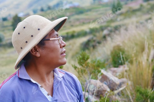 Preview: Serious Native American Man Wearing Hat In The Countryside.