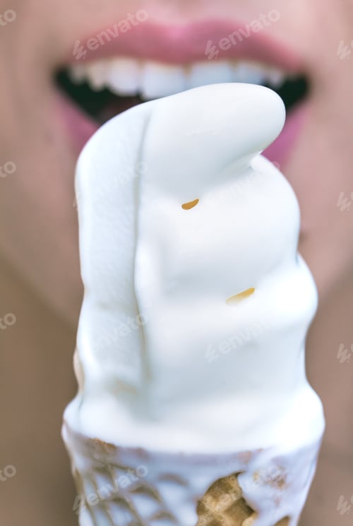 Preview: Picture Of A Woman Eating Ice Cream In Waffle Cone.