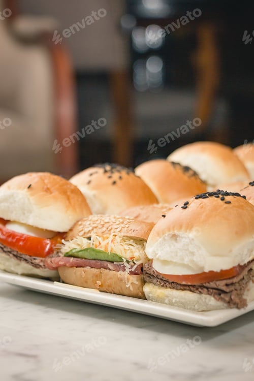 Preview: Delicious Variety of Miniature Sandwiches on a Plate