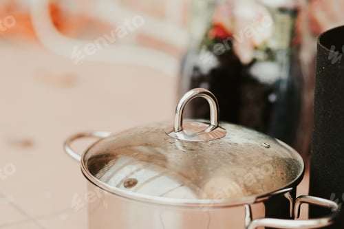 Preview: A View Of Mpan Cooking With Lid Close In The Kitchen