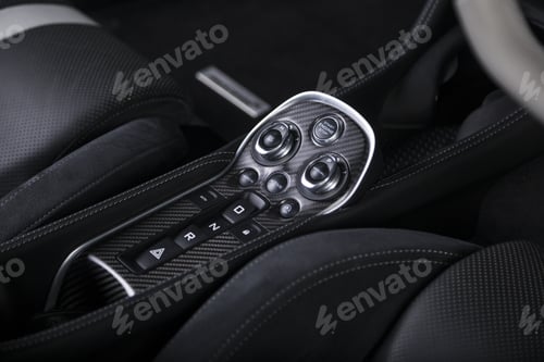 Preview: A Closeup Shot Of The Engine Start Buttons Inside A Modern Sport Car