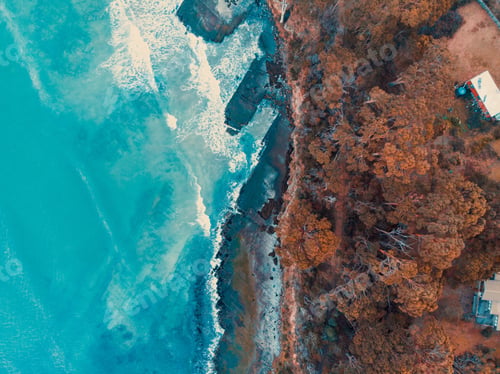 Preview: An Aerial View Of Waves Crashing On Rocks