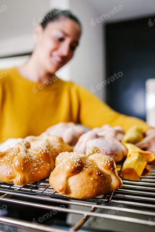Preview: Mexican Woman Baking Bread Called Pan De Muerto Traditional From Mexico In Halloween