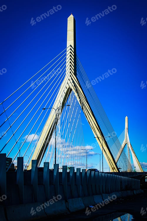 Preview: A Vertical Shot Of A Bridge On A Bright Sunny Day With Very Few Clouds Seen In The Sky