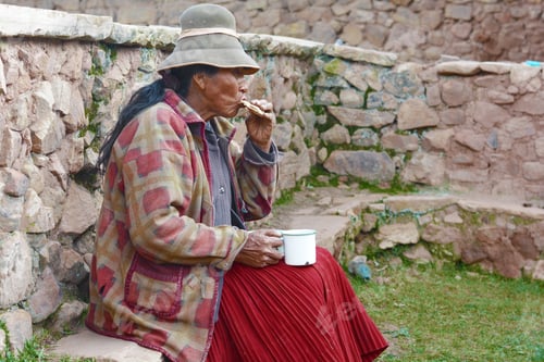 Preview: Old Native American Woman Eating Outside.