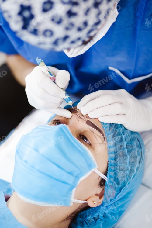 Preview: Latin Cosmetologist Preparing To Mexican Woman For Eyebrow Permanent Makeup Procedure In Mexico