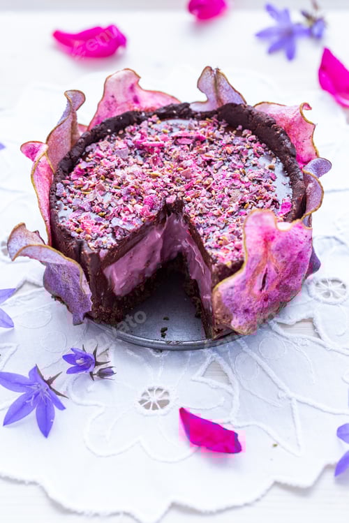 Preview: Delicious Chocolate Cake Garnished with Pink and Purple