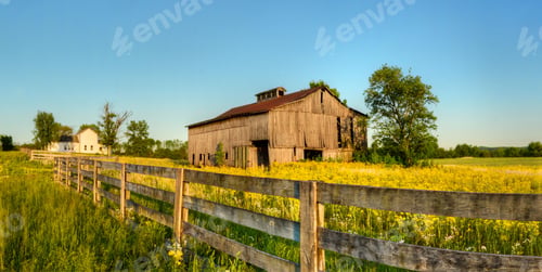 Preview: A Beautiful Sunny Picture Of An Old Wooden Farm In A Field Full Of Yellow Flowers And Trees Next To