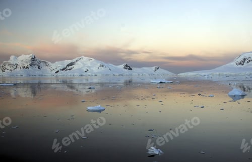 Preview: A Beautiful Shot Of Mountains And Glaciers Reflected In Calm Ocean In Paradise Harbor, Antarctica