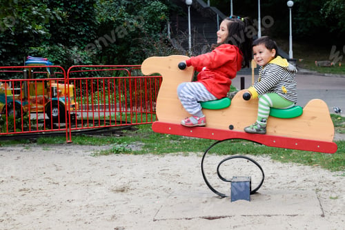 Preview: Little Latin Siblings On The Playground.